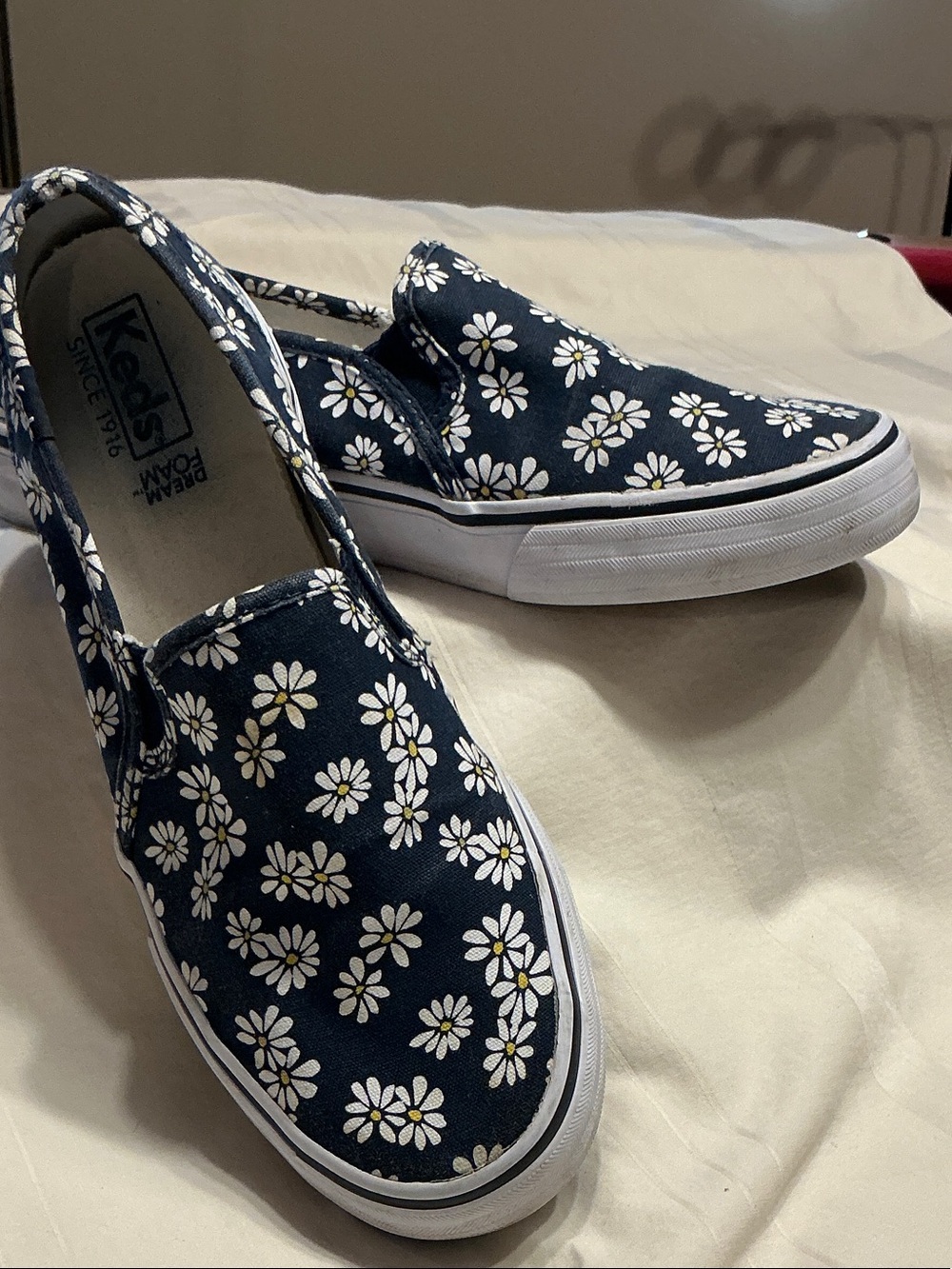 Keds Navy Daisy Slip-On Sneakers with White Floral Print